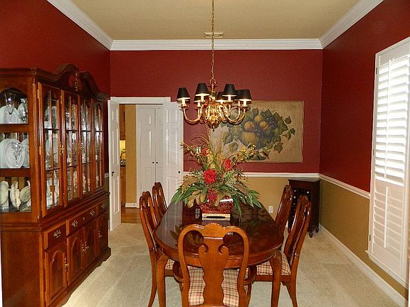 Lovely formal dining area open to the entry with access to the kitchen.