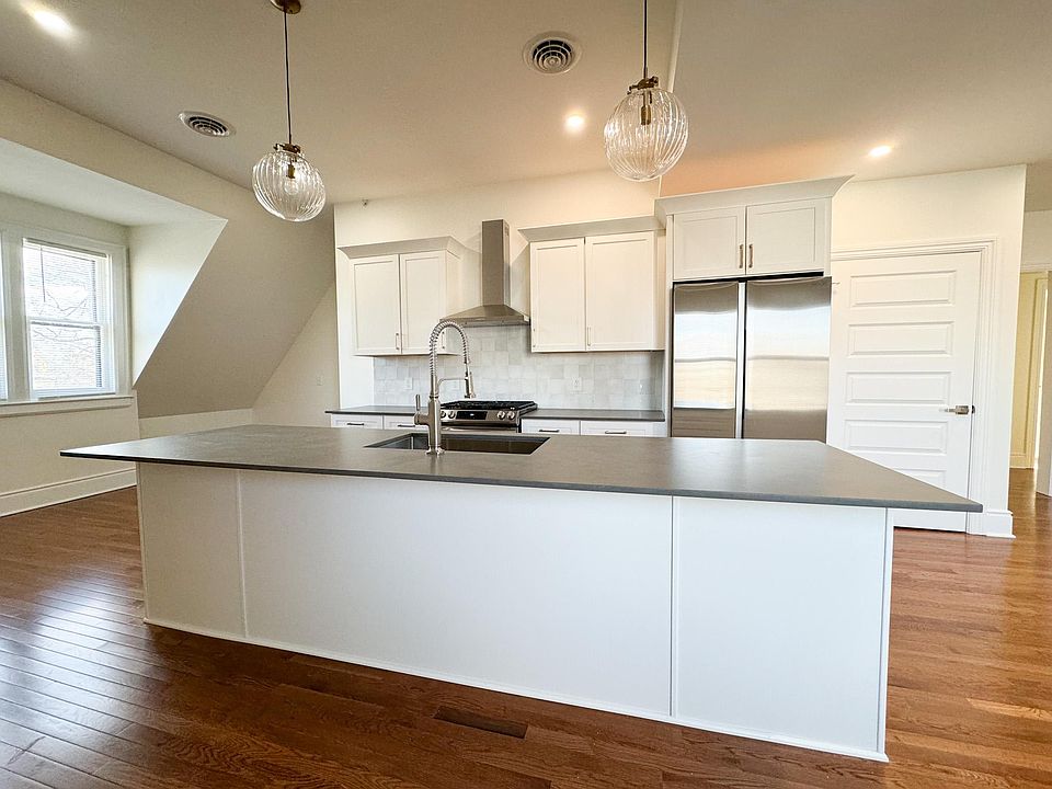 Kitchen with stainless steel appliances and 10' island that seats 6