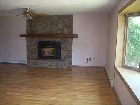 Fire Place From Dining Room! Large Living Room! Stunning Hardwood Floors!