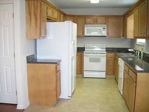 Kitchen is bright and has abundant cabinets. All appliances stay with the home