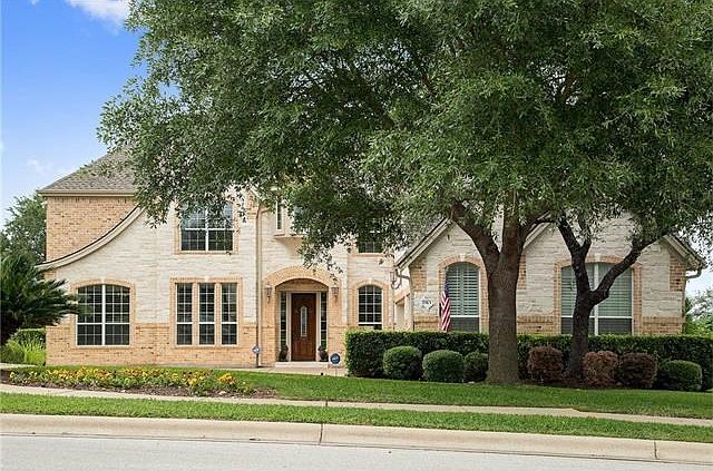 Breathtaking curb appeal, this meticulously kept home is located in a cul-de-sac.