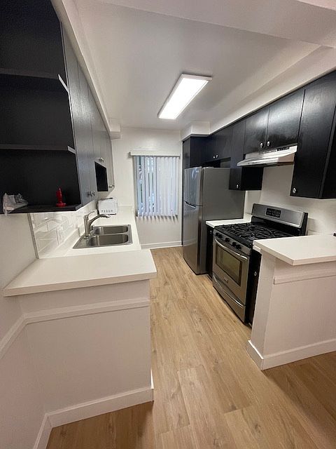 ALL STAINLESS STEEL APPLIANCES, LOTS OF CABINETS AND PANTRY