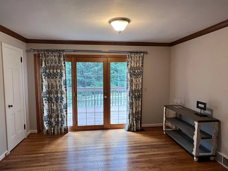 Living area door opens for fresh air and a huge deck.