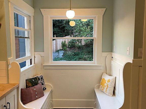 Restored original dining nook with raw brass midcentury lighting