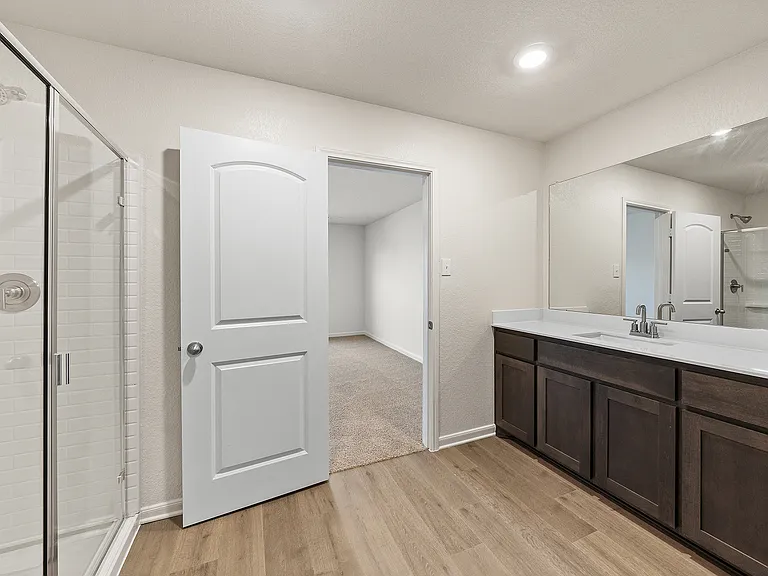 The master bathroom of the Sabine has a large, glass walk-in shower.