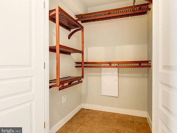 Large foyer closet with custom built-ins.