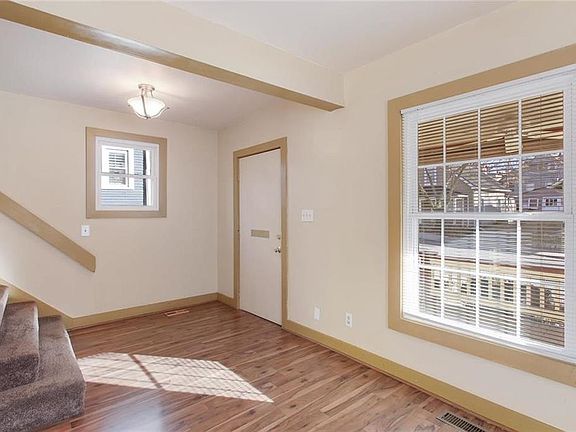 Alternate view of the entryway and staircase leading upstairs.