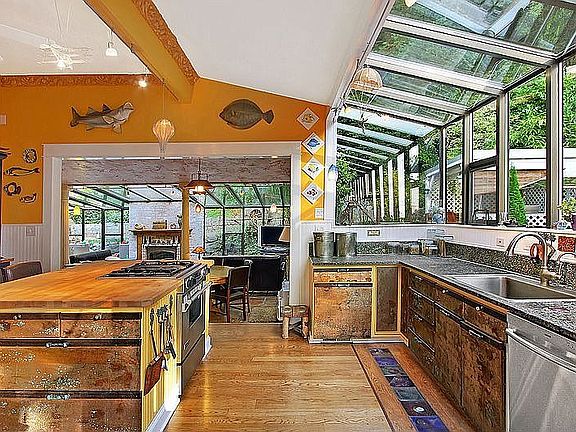 Chef's Kitchen is piece of art.  Back lit glass tile line the floor