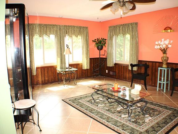 Main level family or great room with a fireplace.  Nice, large room with ceramic flooring.