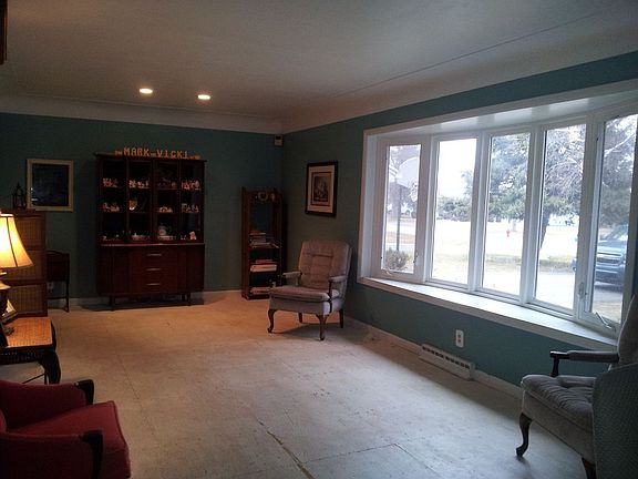 Beautiful bow window adds to rooms appeal.