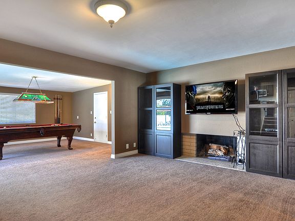 Family room w/ fireplace and added game room