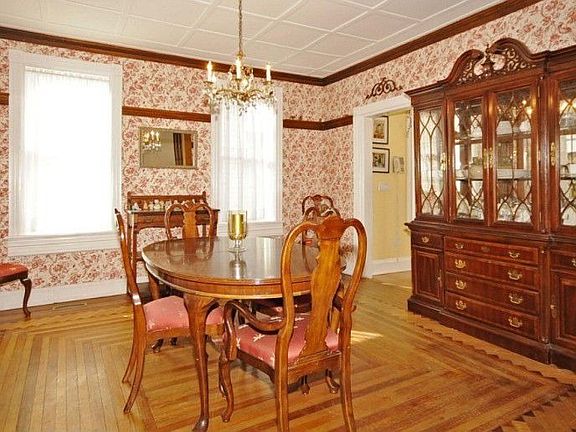 Gorgeous Dining room with in-laid hardwood floors.