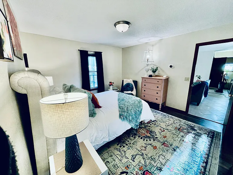 Bathroom is off the bedroom and has a shower over tub and plenty of storage