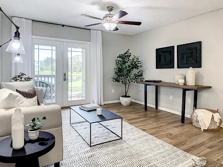 Embrace tranquility in our serene living spaces, featuring elegant wood-style flooring, cozy lighting, and access to private patio sanctuaries.