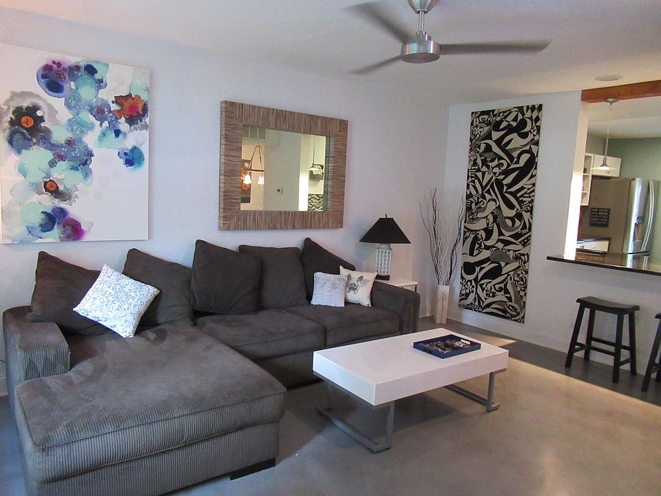 Living Room. Stained concrete floors throughout living, dining and kitchen.