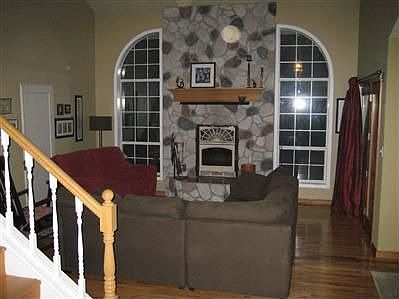living room - floor to ceiling rock fireplace