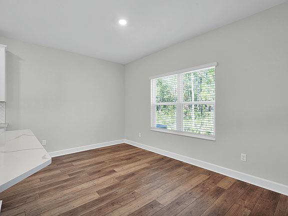The dining room is perfect for all of your meals with a large window
