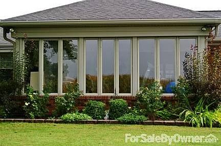 Sunroom w/quarry tile, cherry paneling.
						:
						400 sq. ft, rear-facing, two exits.