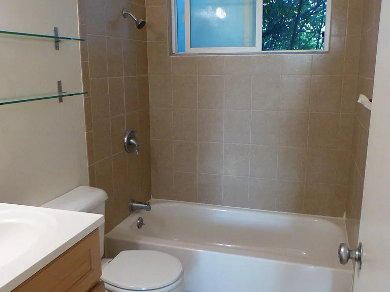 Bathroom (tiles on floor and shower/tub wall)