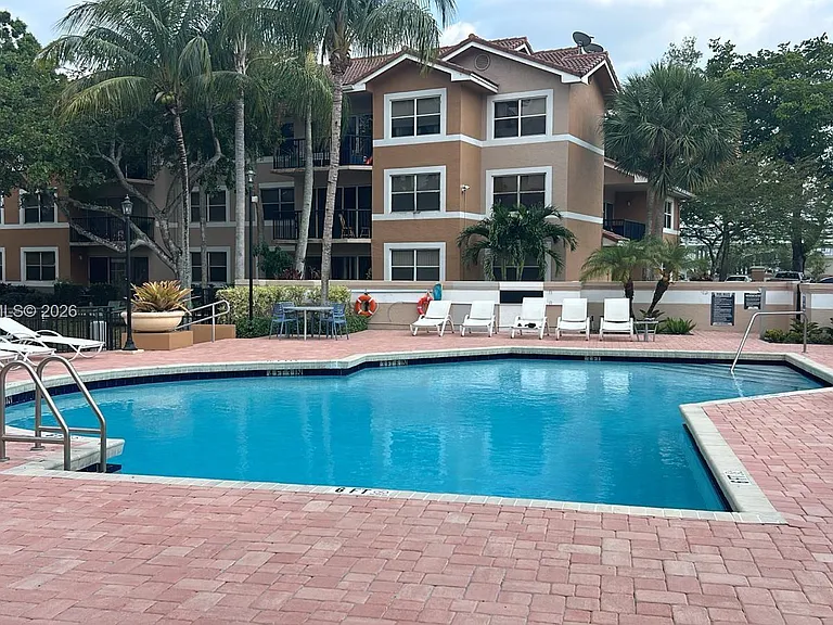 8851 Wiles Rd #208 — Photo 21