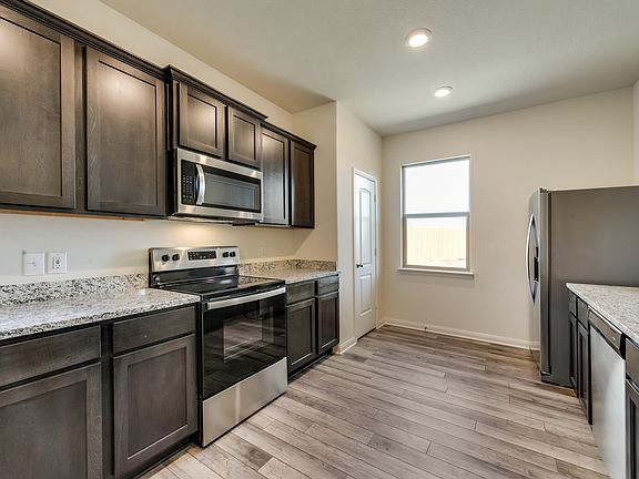 The kitchen comes with a full suite of energy-efficient appliances