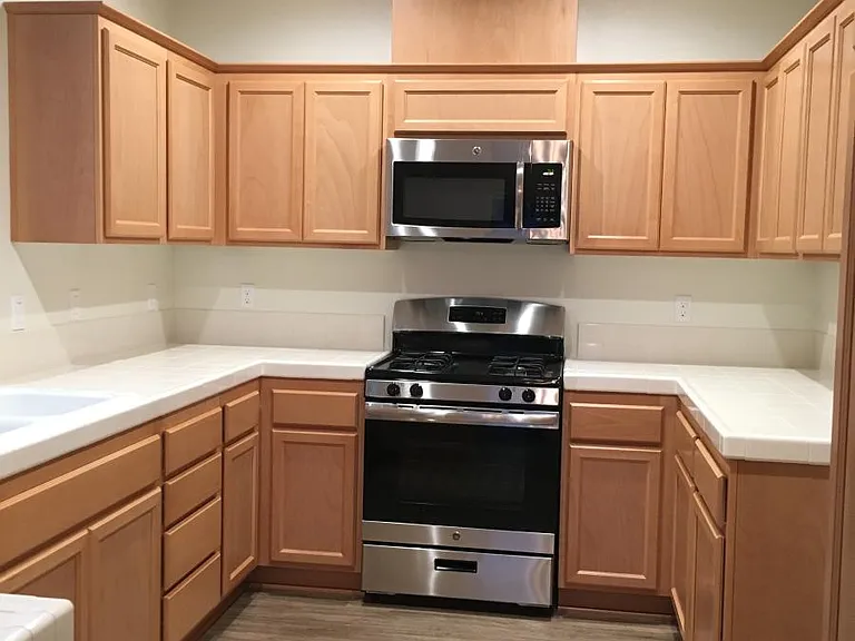 Very clean kitchen with microwave, stove and dishwasher. Refrigerator and under the sink reverse osmosis have been added.