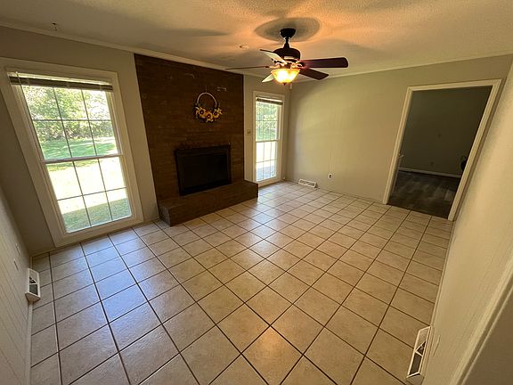 Dining room or Den at rear of house. Fireplace is not functional.