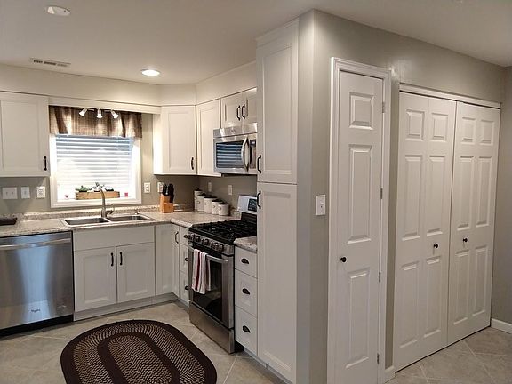 Kitchen with adjoining pantry and laundry area