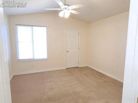 Master bedroom with lifted ceiling and walkin closet.