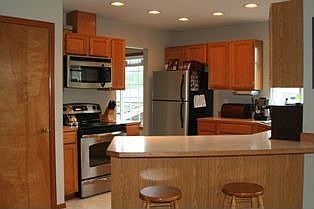 Bright Kitchen with all new Stainless Steel appliances 