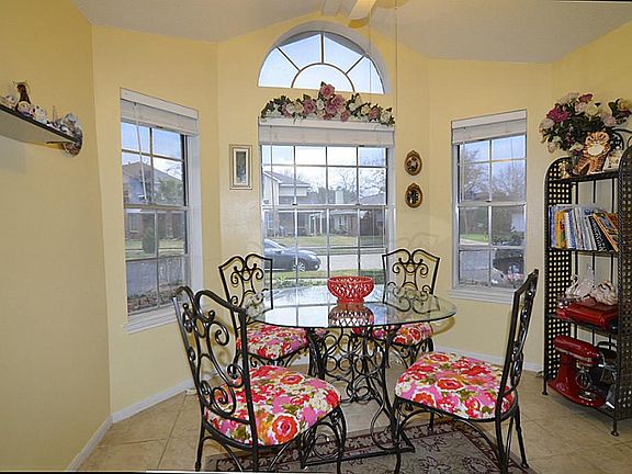 Light and Bright breakfast room with bay windows! Plenty of room for extra storage.