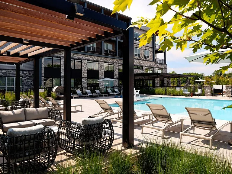 Pool and sundeck with lounge seating