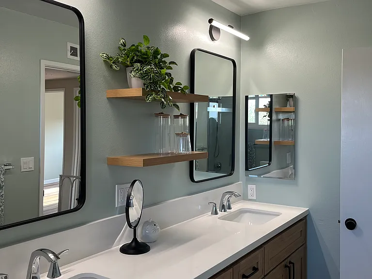 Upstairs full bath with double sinks and plenty of storage.