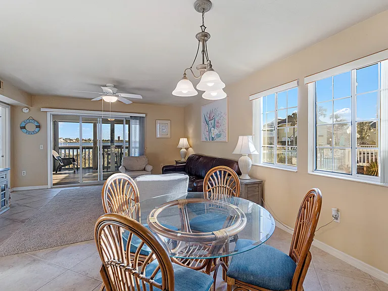 Enjoy the sunset views while eating dinner at the dining room table or dine al fresco at the high-top table on the screened-in porch.