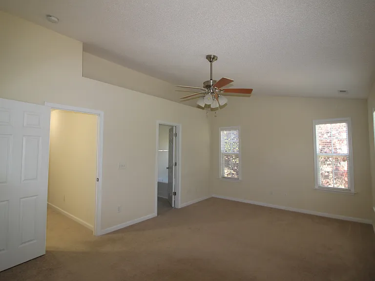 Master bedroom with vaulted ceiling