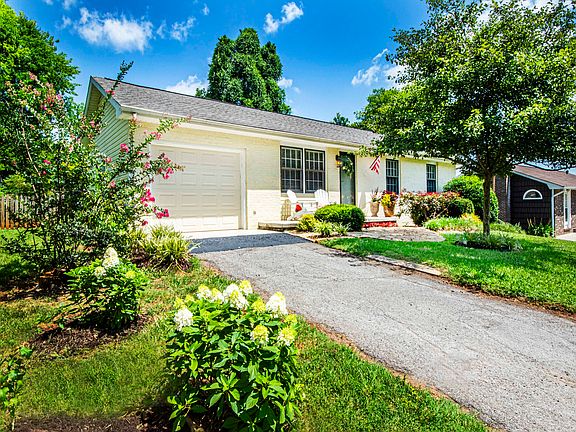 Please notice the professionally landscaping which adds curb appeal......FYI we maintain the yard and add seasonal flowers each season....NO mowing for you