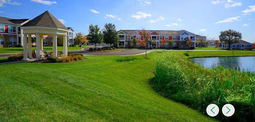 The apartment building is the one your are looking at in the center, my unit is on the 2nd story, extreme right side. It looks over a grassy area and the pond.
