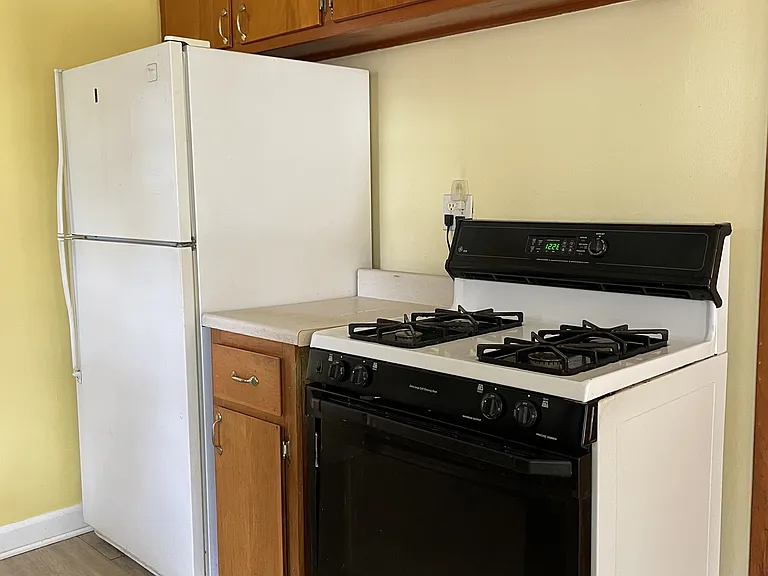 Kitchen with included gas range and refrigerator