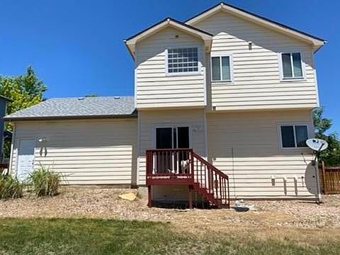 back of house, note: way more grass/yard not pictured