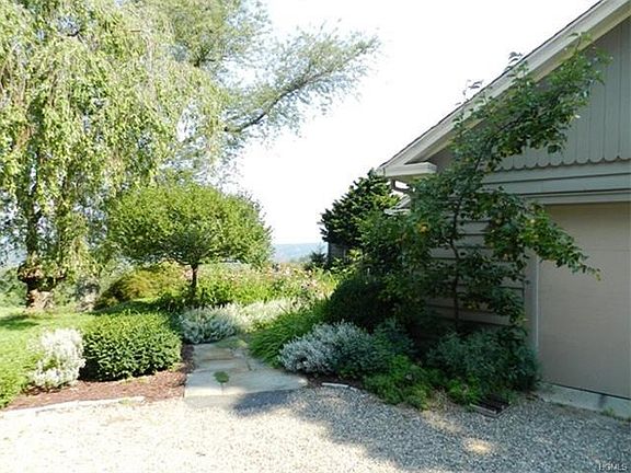 Blacktop driveway with oil and stone top for country appeal