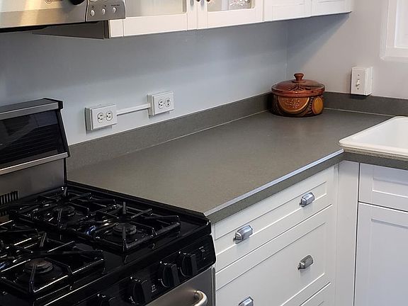 Updated beautiful kitchen with stainless applances and huge pots and pans drawers...