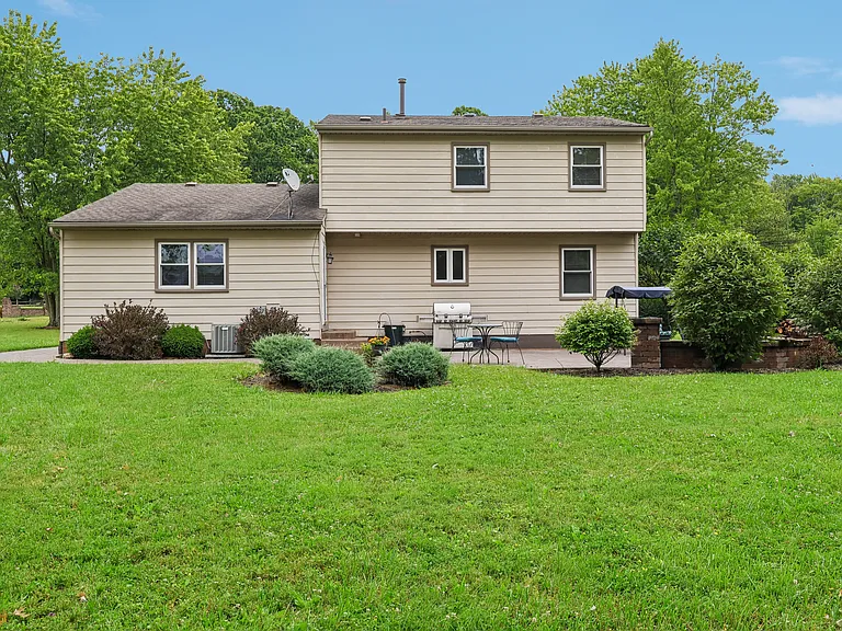 Rear of home with patio