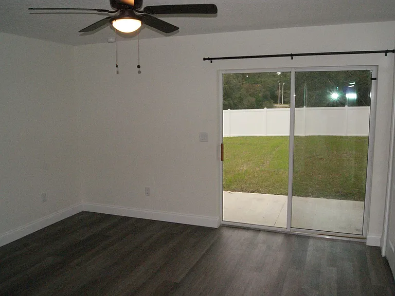 Primary bedroom with view of the backyard