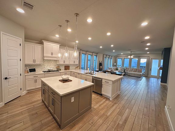 open concept kitchen, dining, living room