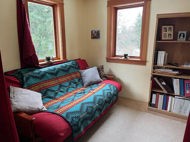 BR 1 on main floor, staged with furniture