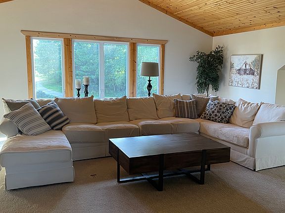sectional, coffee table, sofa table, lamp, tree and artwork all come with the Loft
