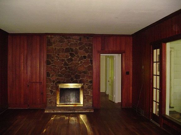 living room with hardwood floors and fireplace