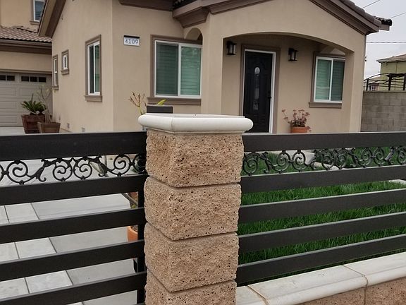 side view of the house behind sliding electric gate