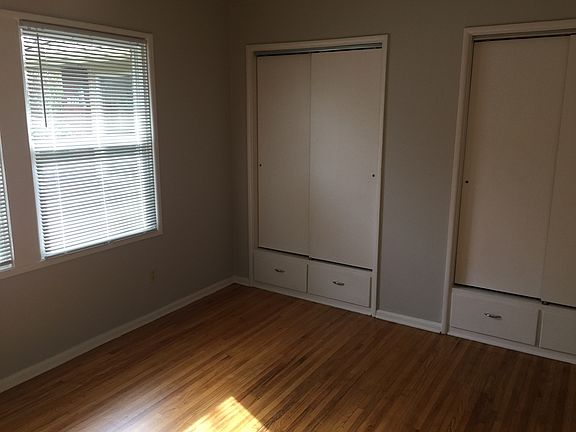 bedroom with his and her's closet