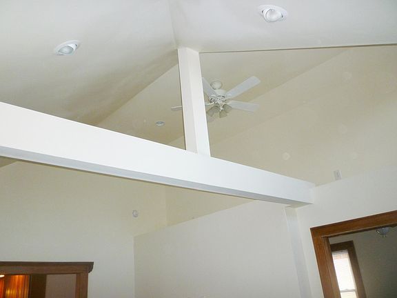 vaulted living room ceiling. Ceiling fan, led recessed lights.